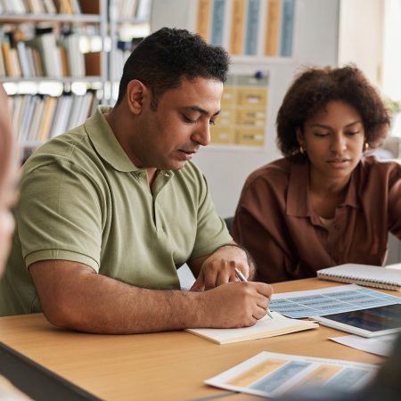 Group of multiethnic students learning foreign language together in class